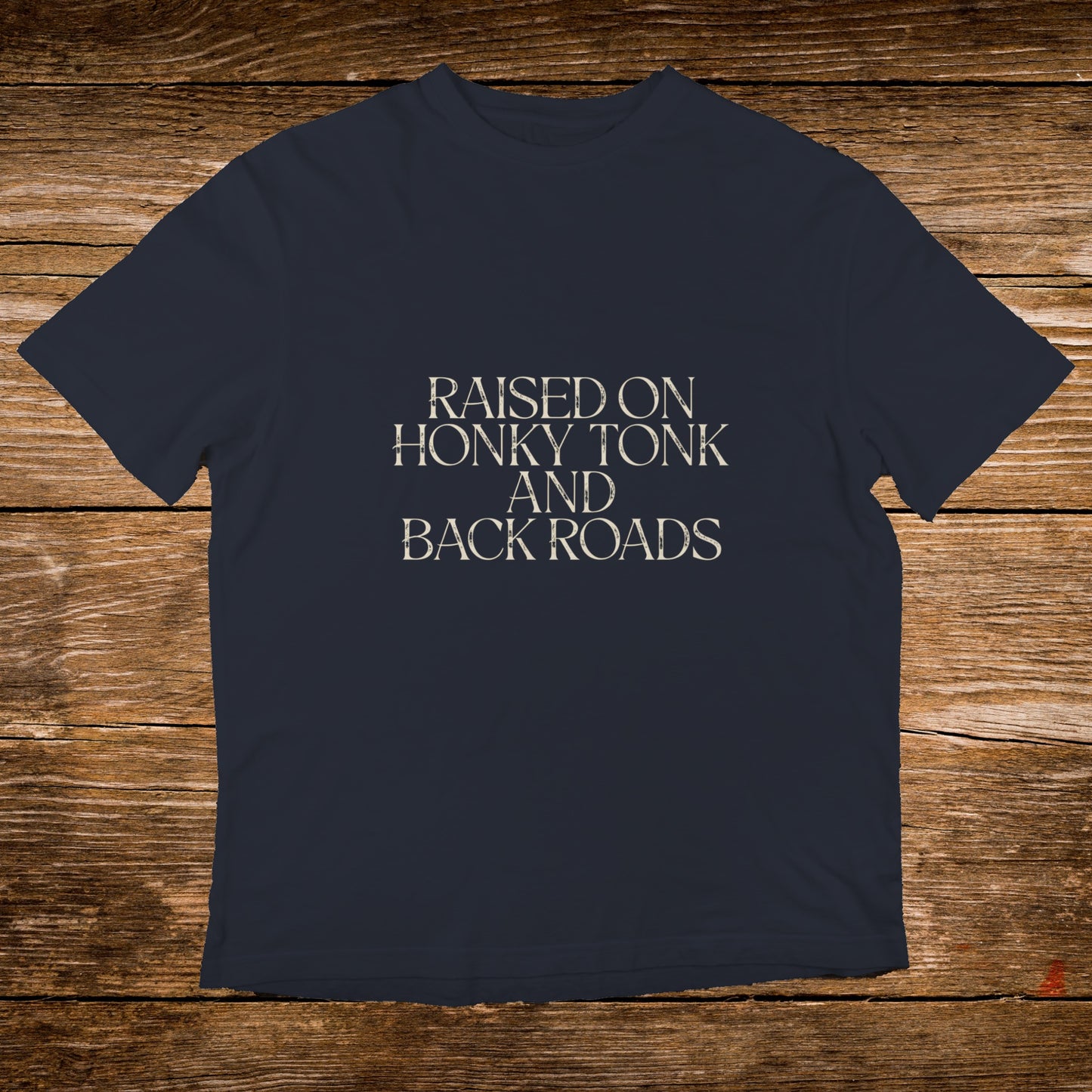Navy t-shirt with "RAISED ON HONKY TONK AND BACK ROADS" text.