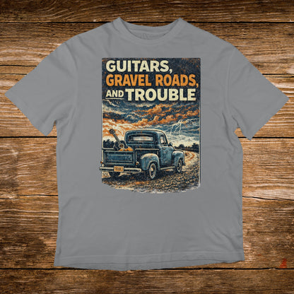 Blue pickup truck with guitars in bed, text "Guitars, Gravel Roads, and Trouble".