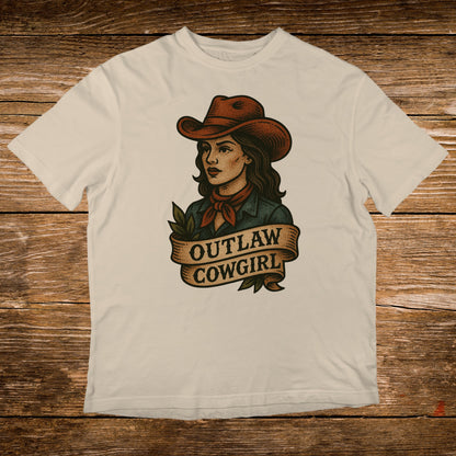 T-shirt with a vintage-style illustration of an outlaw cowgirl on a banner.