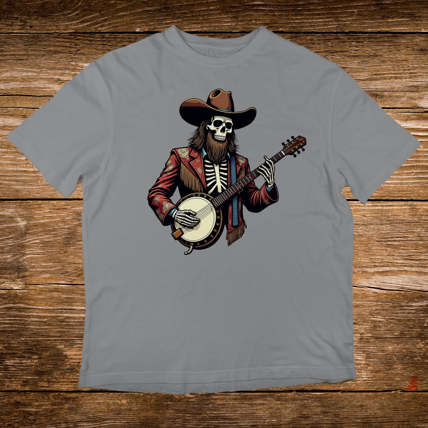 Skeleton in cowboy hat and jacket playing banjo on grey t-shirt.