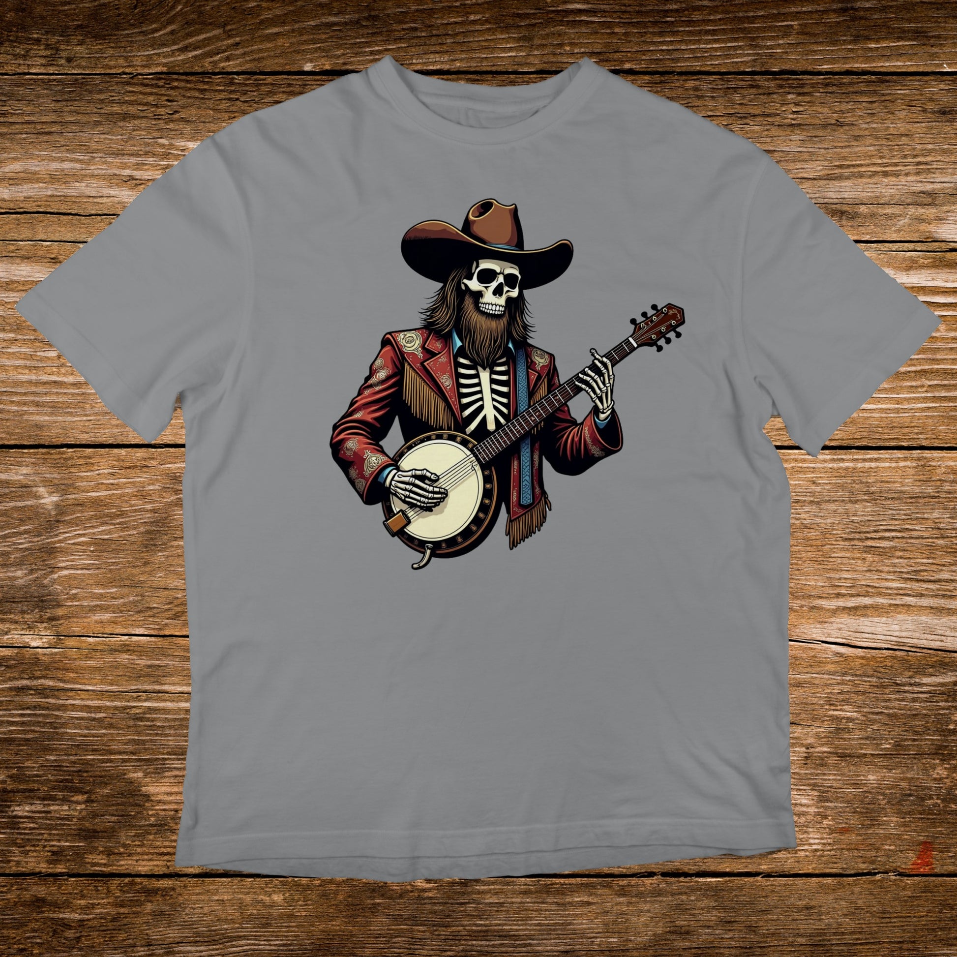Skeleton in cowboy hat and jacket playing banjo on grey t-shirt.