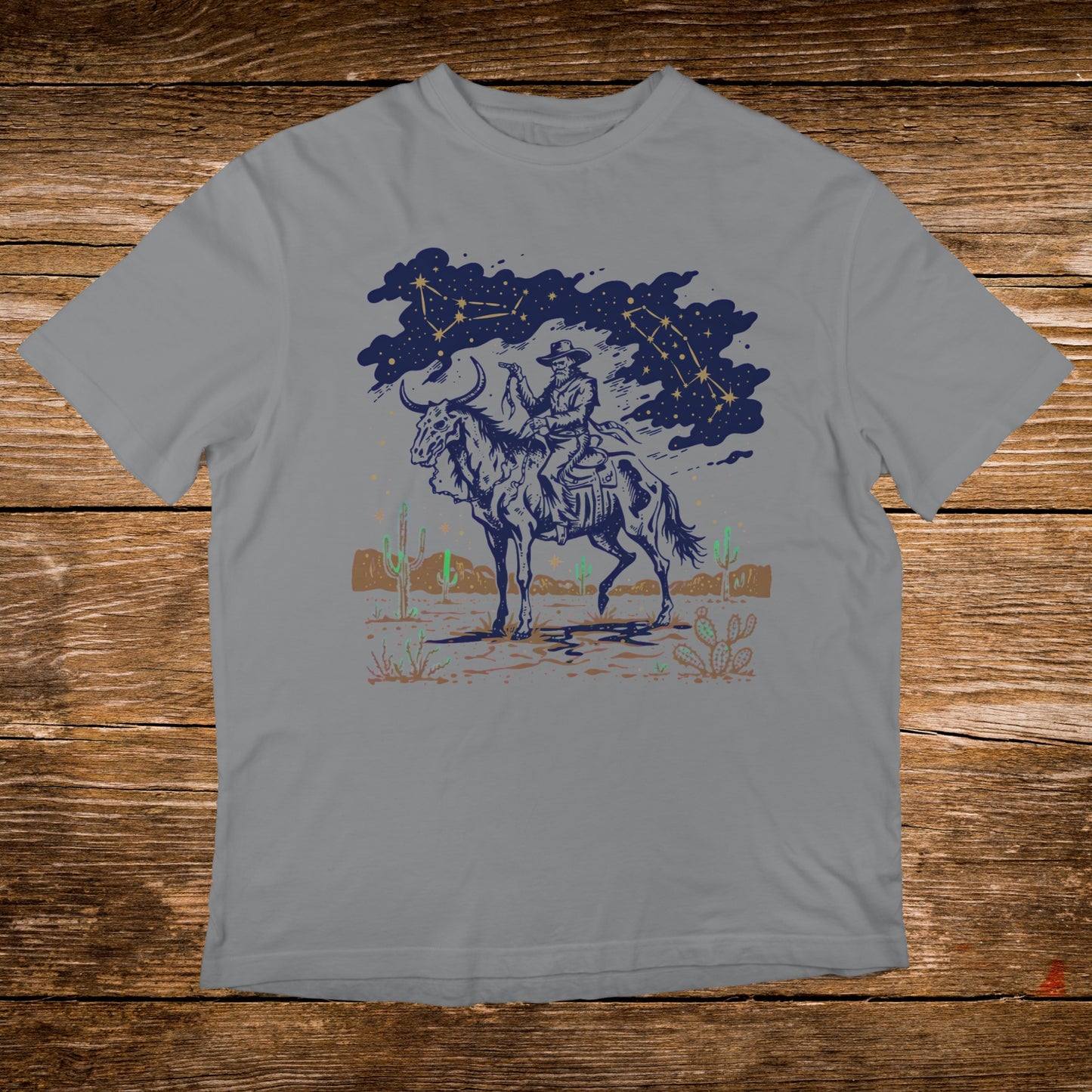 Cowboy riding a horse with constellations and desert landscape.