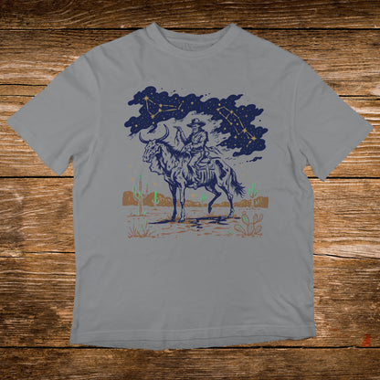 Cowboy riding a horse with constellations and desert landscape.