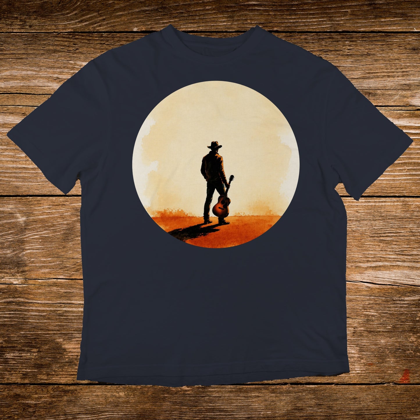 Cowboy with guitar silhouette against a large circle, on a navy t-shirt.