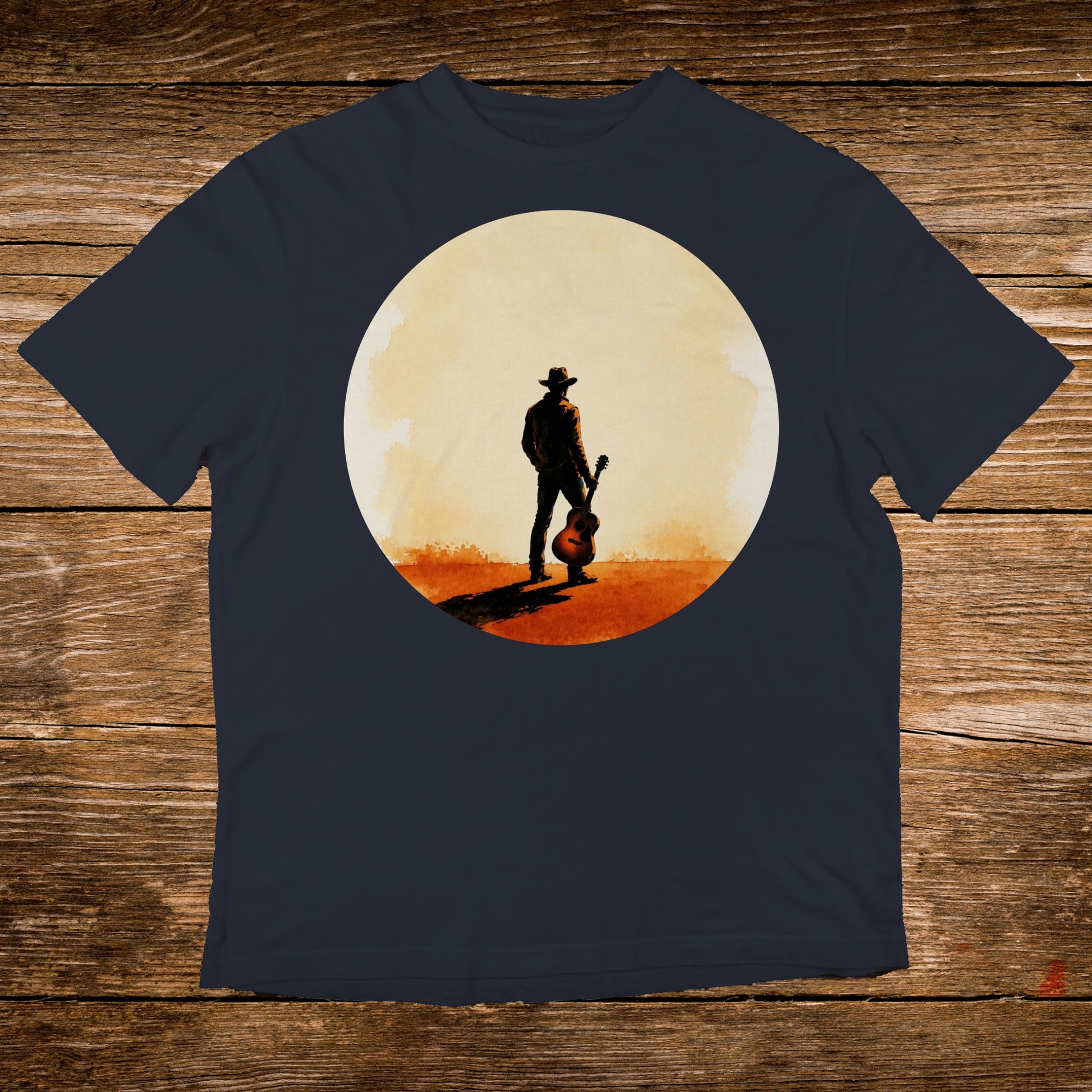 Cowboy with guitar silhouette against a large circle, on a navy t-shirt.