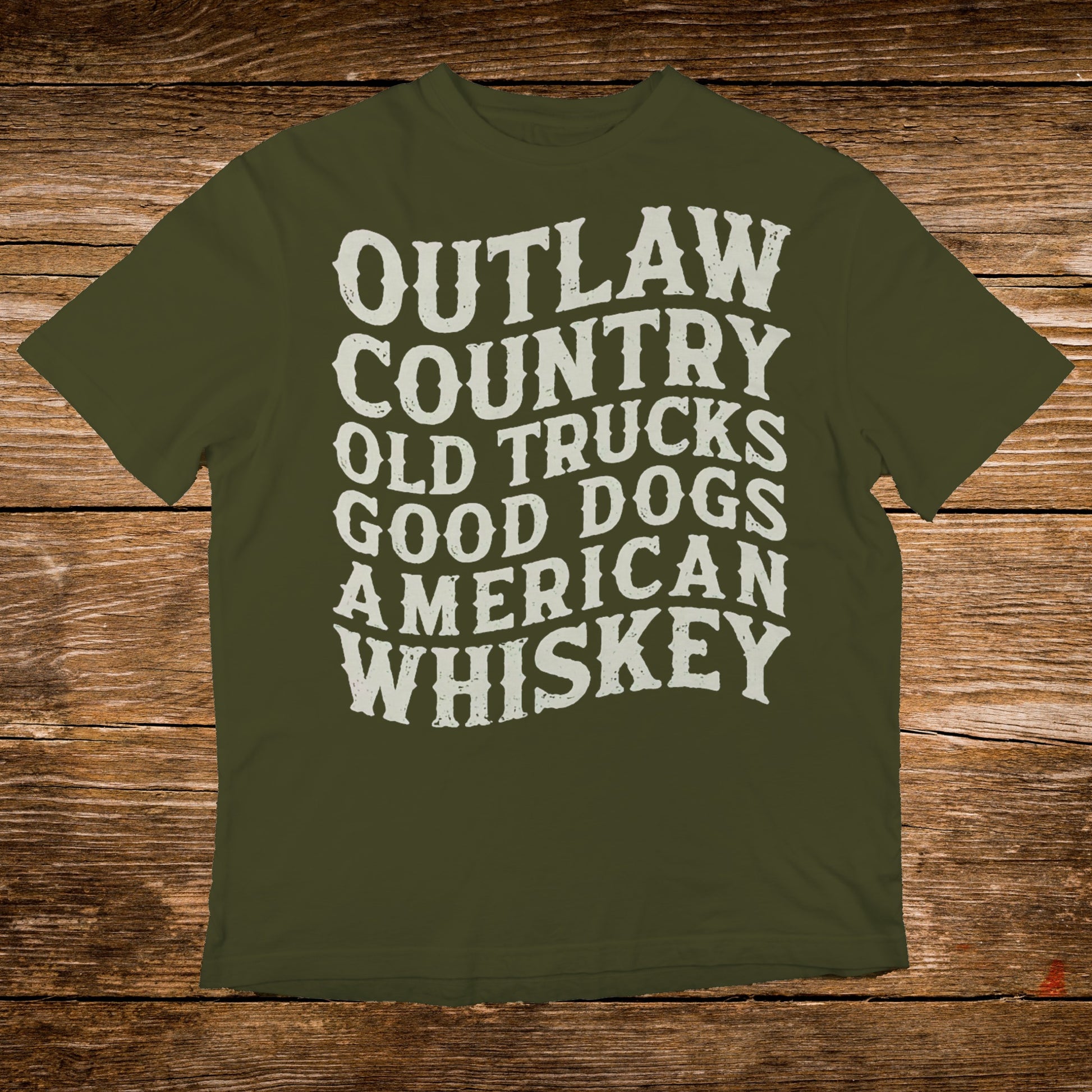 Olive green t-shirt with white text: Outlaw Country, Old Trucks, Good Dogs, American Whiskey.