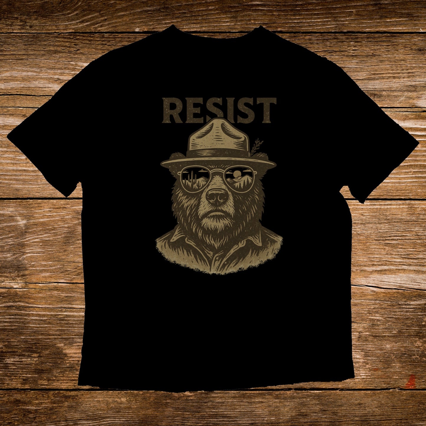 Black t-shirt with graphic of a bear wearing a hat and sunglasses, text "RESIST".