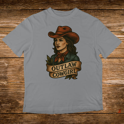 Outlaw Cowgirl illustration on a grey t-shirt.