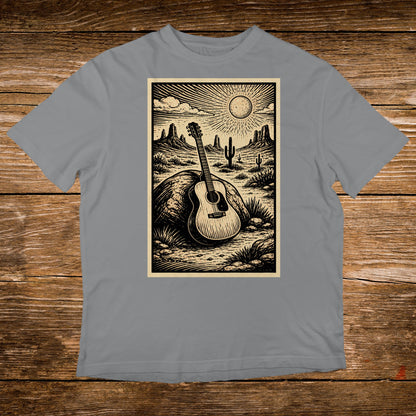 Acoustic guitar rests against rock in desert landscape with sun and mountains.