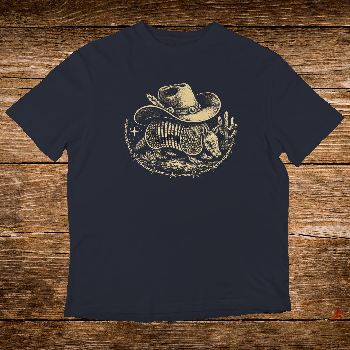 Navy t-shirt with a cowboy hat-wearing armadillo graphic and cacti.