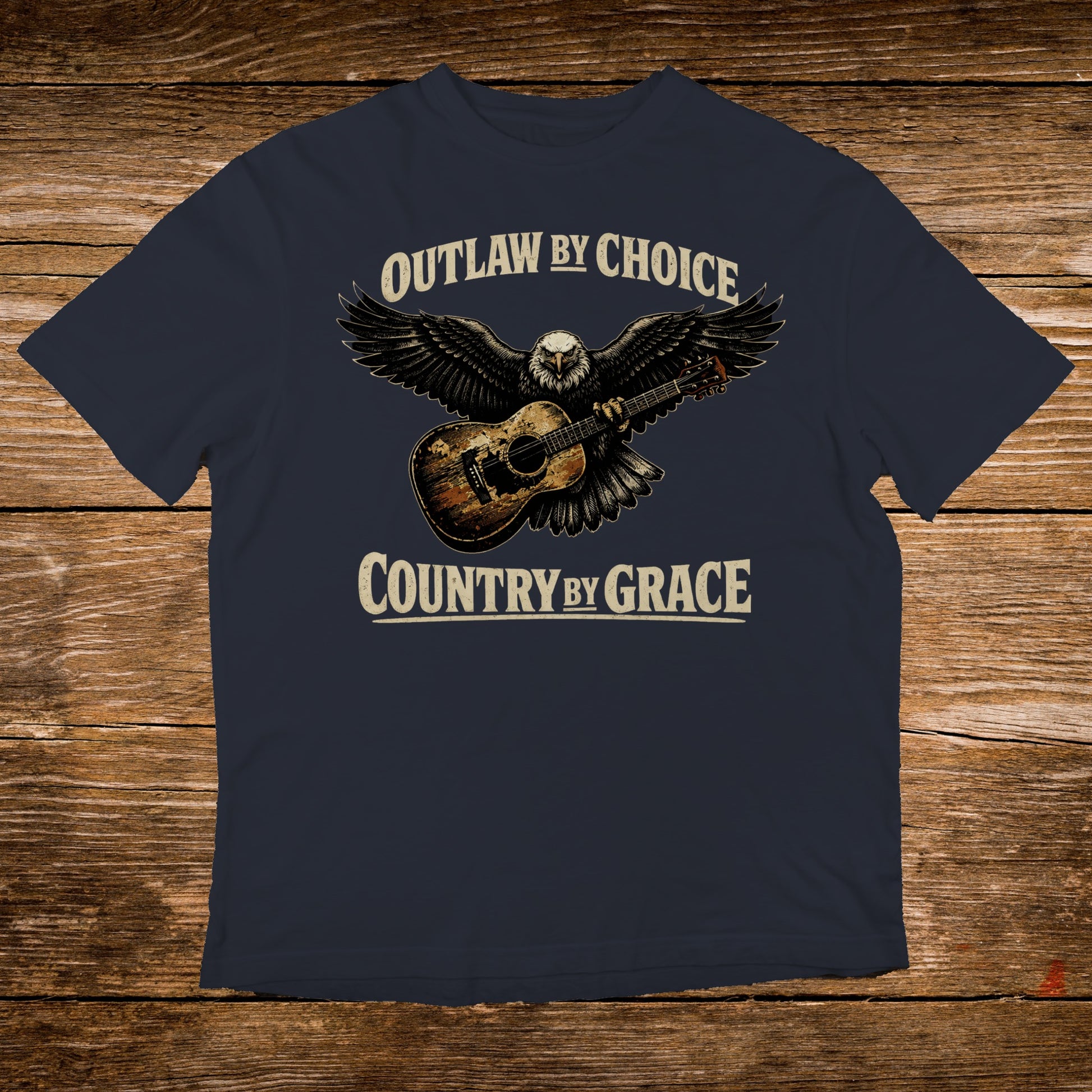 Navy t-shirt with eagle, guitar, and text "Outlaw by Choice, Country by Grace".