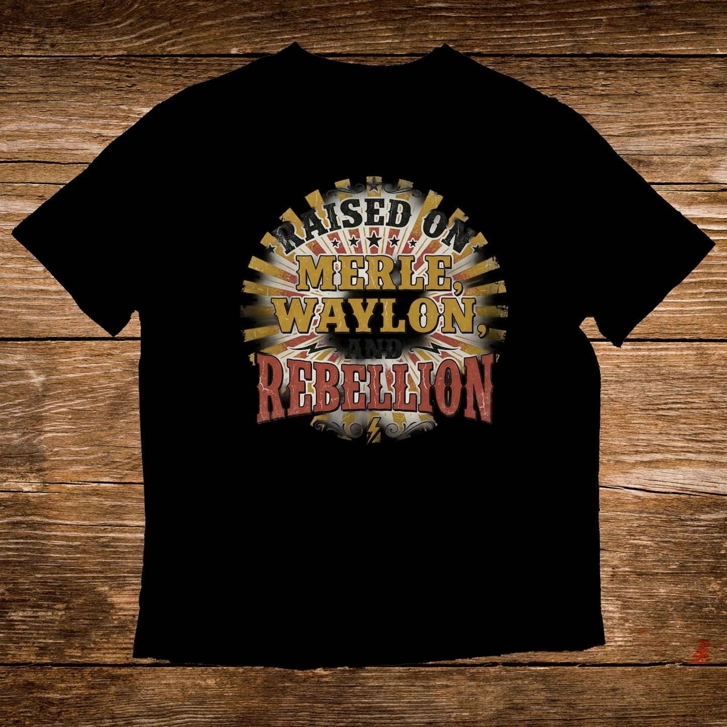 Black t-shirt with "Raised on Merle, Waylon, and Rebellion" text.