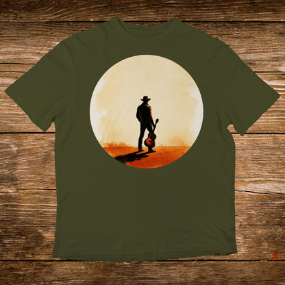 Cowboy with guitar silhouetted against a setting sun on a t-shirt.
