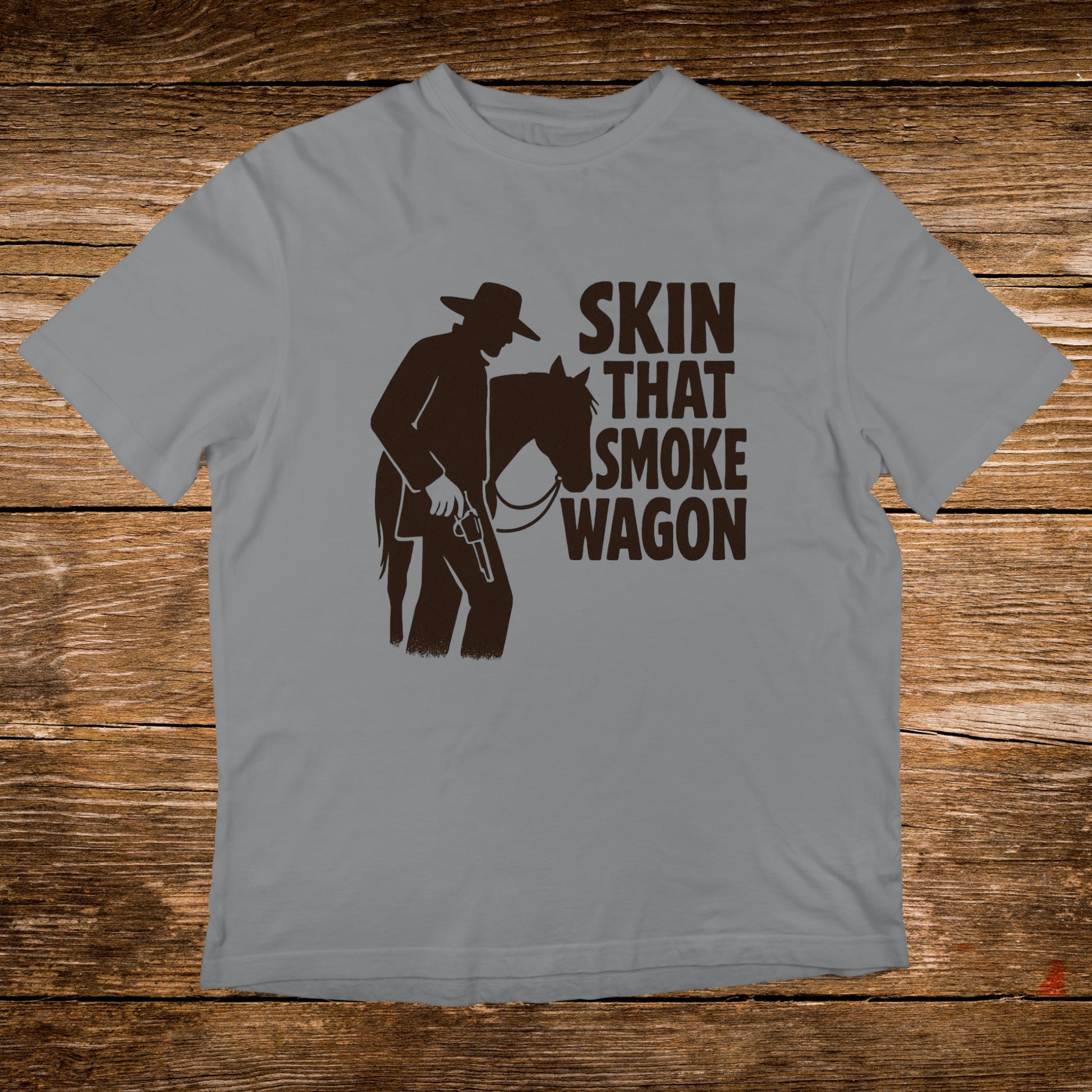 Grey t-shirt with "Skin That Smoke Wagon" text and cowboy silhouette.