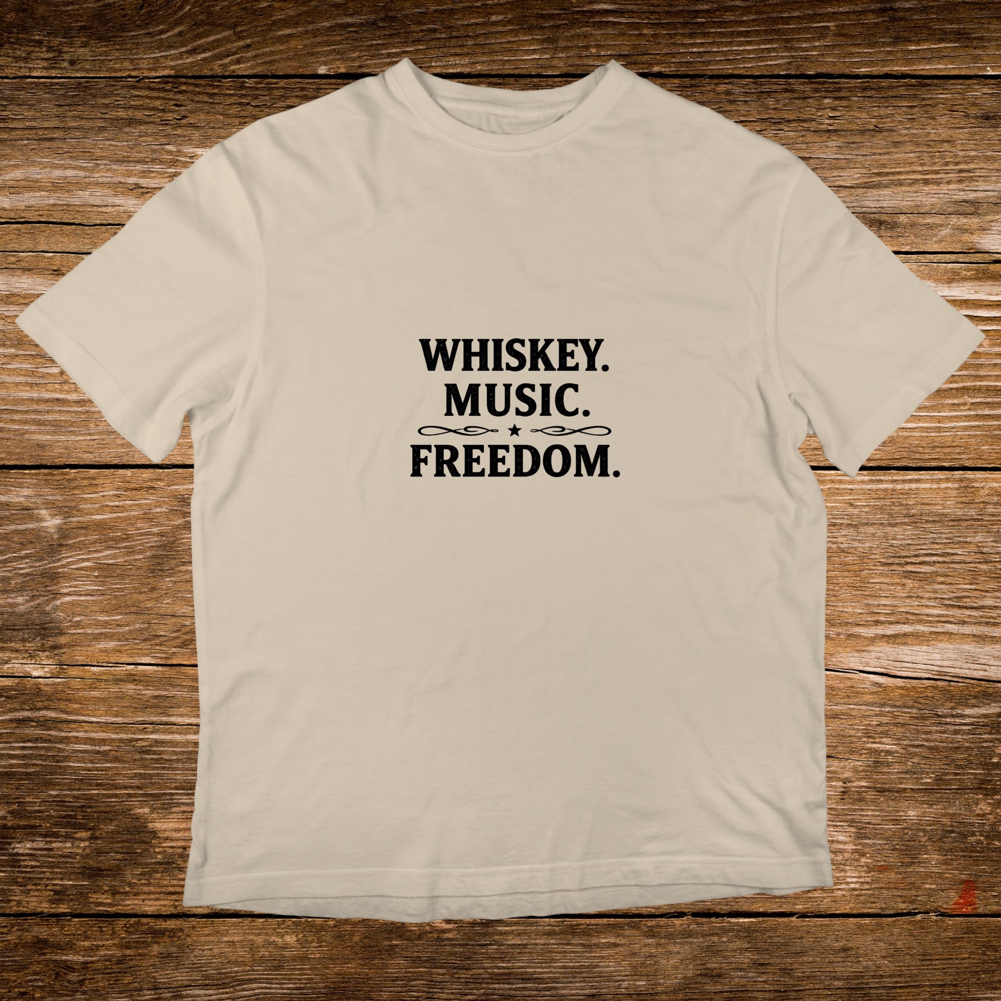 Cream t-shirt with black text "WHISKEY. MUSIC. FREEDOM."