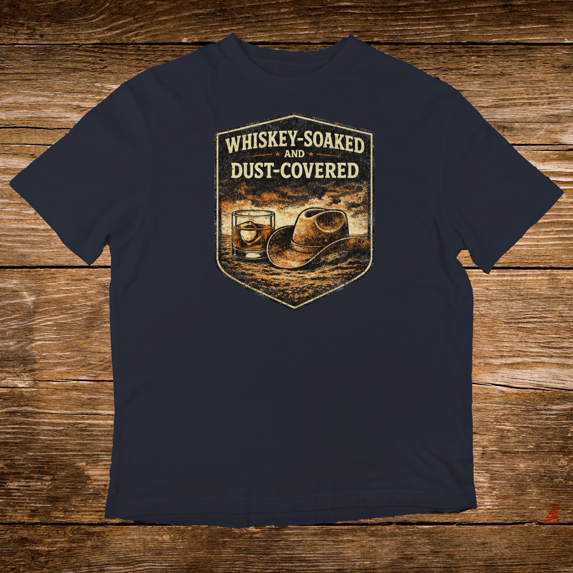 Navy t-shirt with distressed "Whiskey-Soaked and Dust-Covered" graphic.