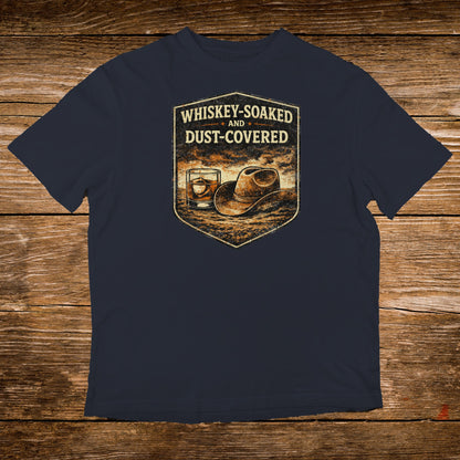 Navy t-shirt with distressed "Whiskey-Soaked and Dust-Covered" graphic.