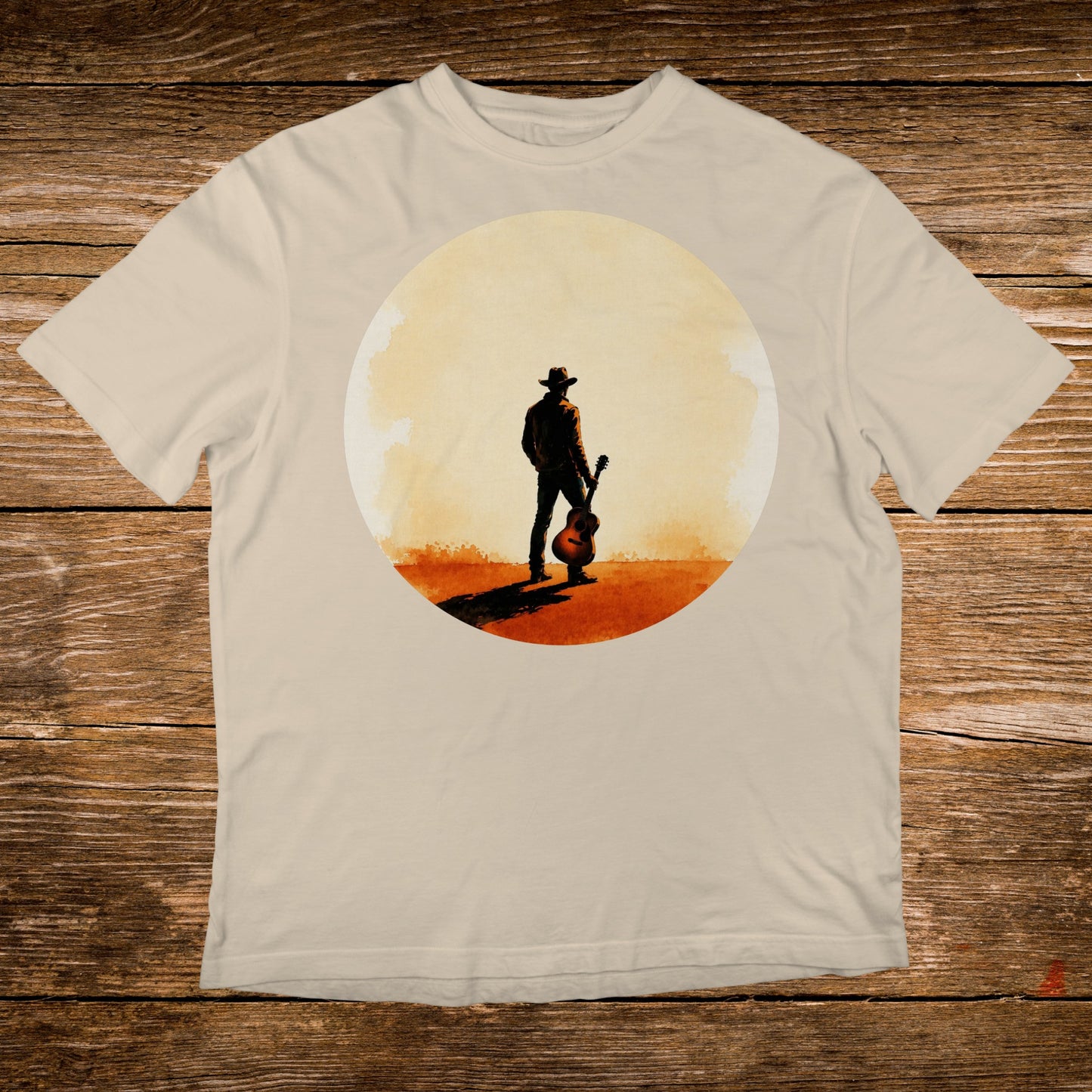 Man in cowboy hat holding acoustic guitar in sunlit desert landscape.