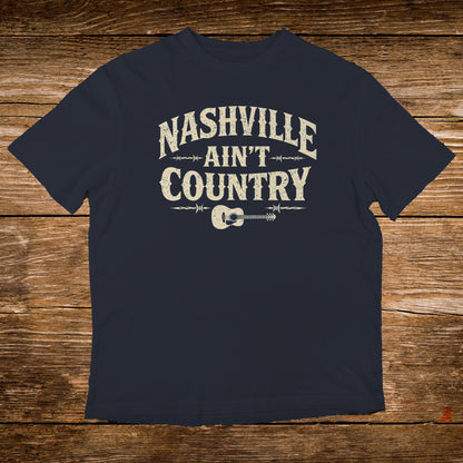 Dark navy t-shirt with "Nashville Ain't Country" text and guitar graphic.