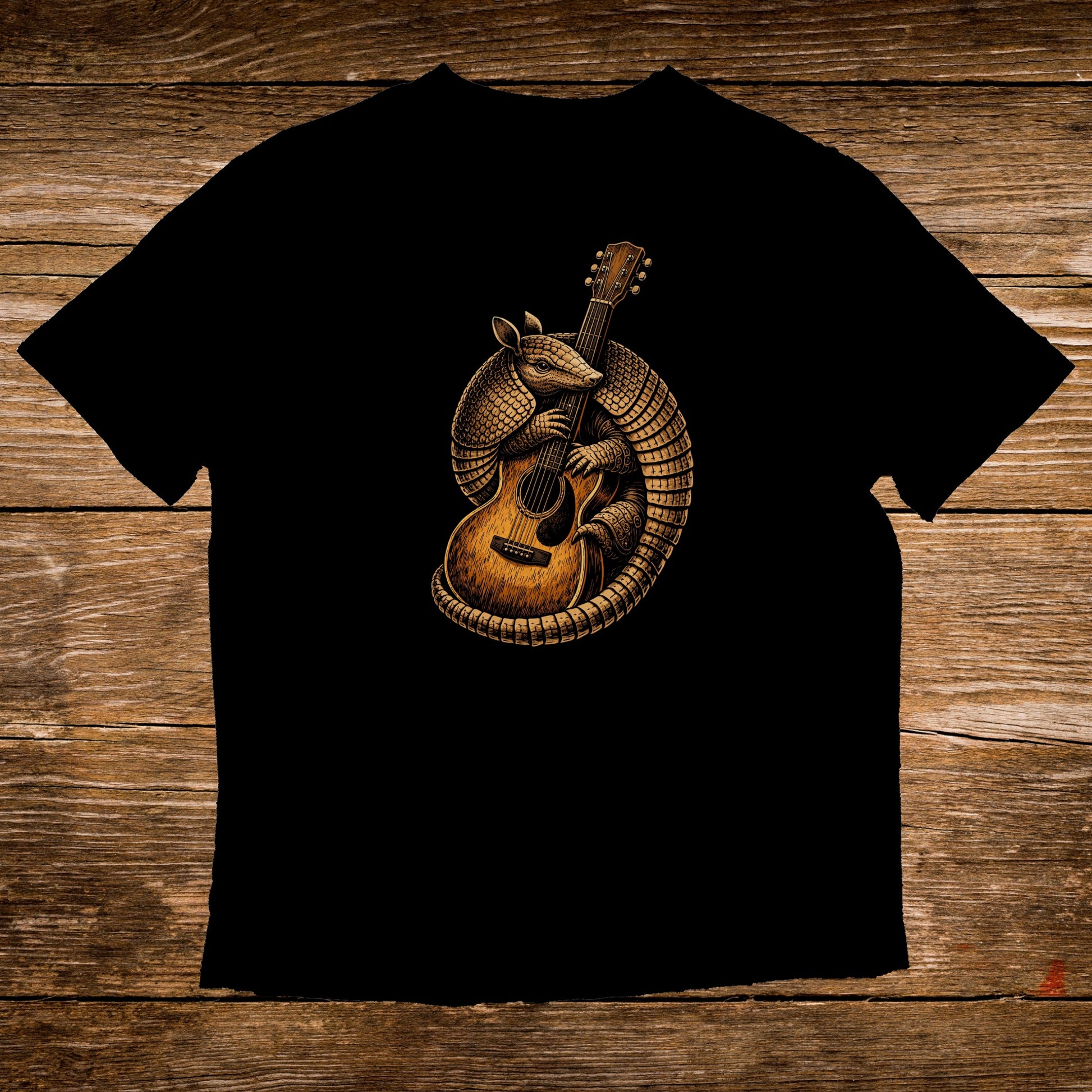 Armadillo playing a guitar on a black t-shirt.