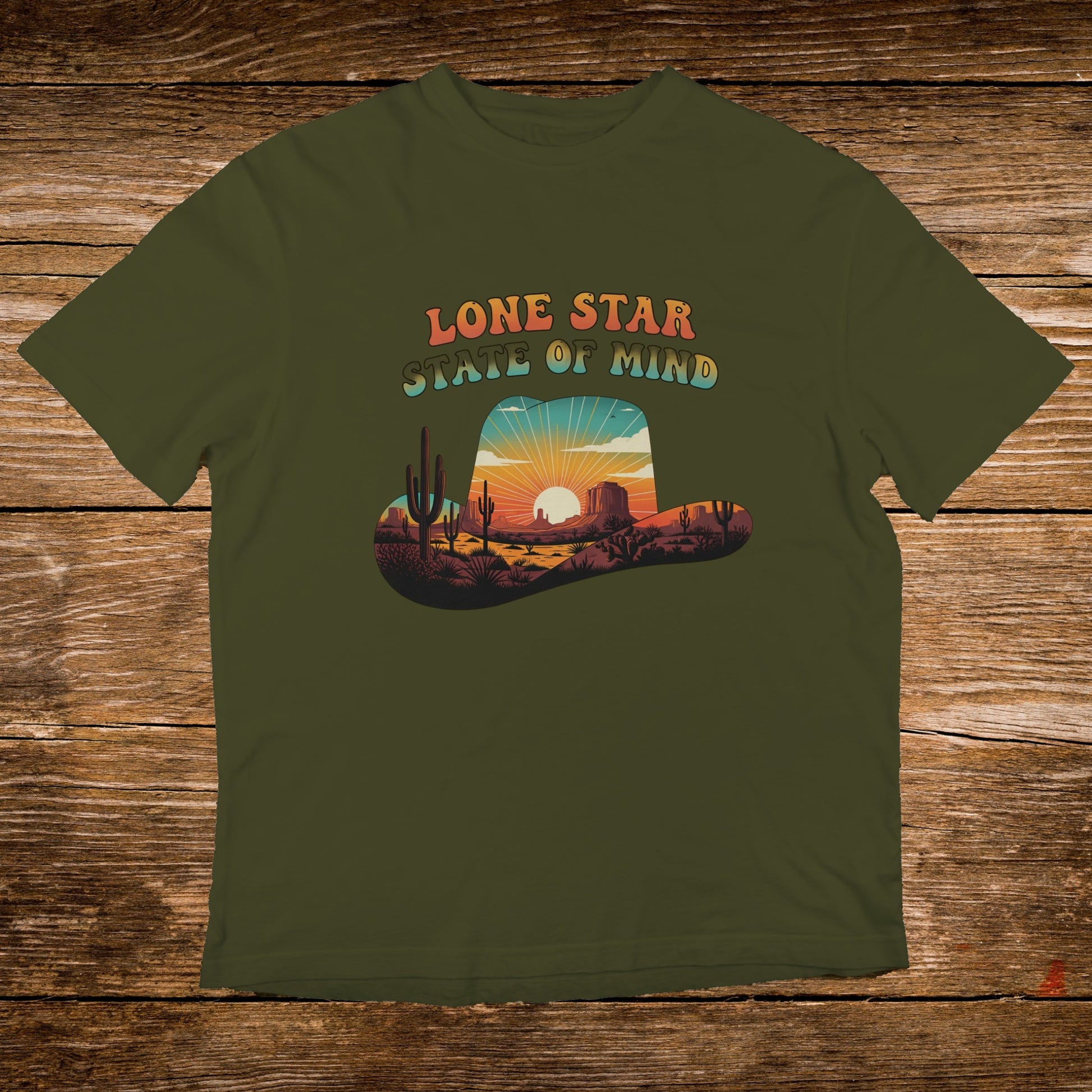 Olive t-shirt with a desert landscape inside a cowboy hat, featuring "Lone Star State of Mind" text.