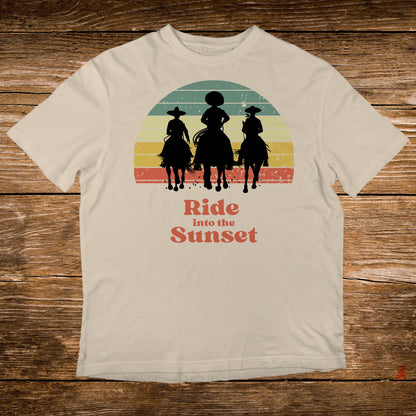 T-shirt with sunset graphic of three horseback riders and text "Ride into the Sunset".