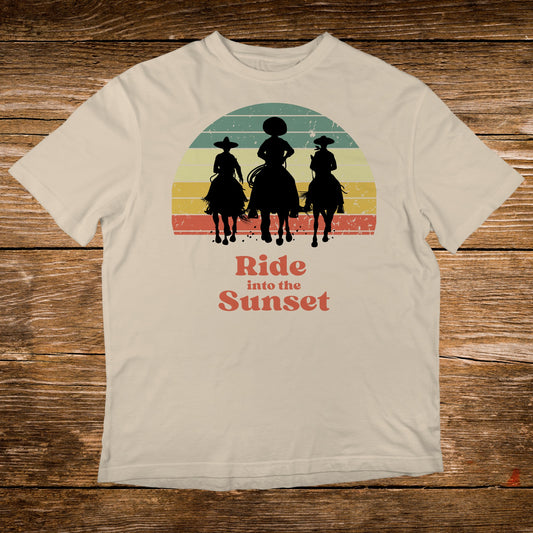 T-shirt with sunset graphic of three horseback riders and text "Ride into the Sunset".