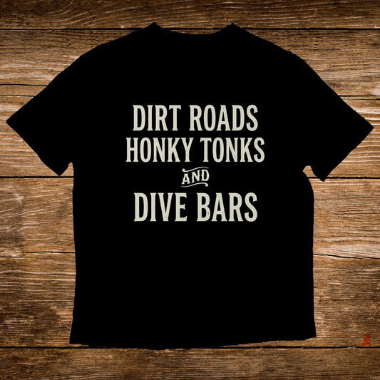 Black t-shirt with white text "Dirt Roads Honky Tonks and Dive Bars".