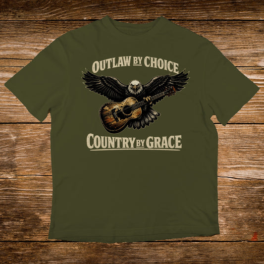 Olive green t-shirt with an eagle and guitar graphic, text reads "Outlaw by Choice, Country by Grace".