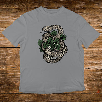Snake coiled around a shamrock plant on a grey t-shirt.