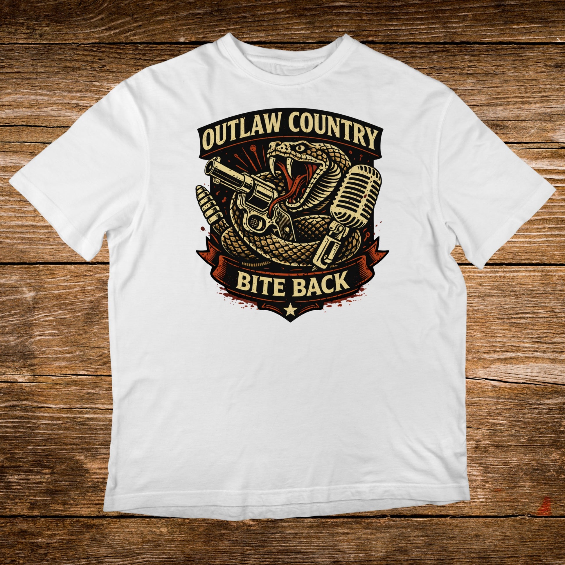 White t-shirt with Outlaw Country Bite Back graphic featuring snake, gun, and microphone.