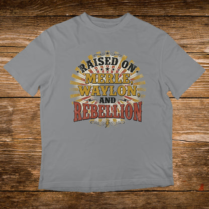 Grey t-shirt with "Raised on Merle, Waylon, and Rebellion" text.
