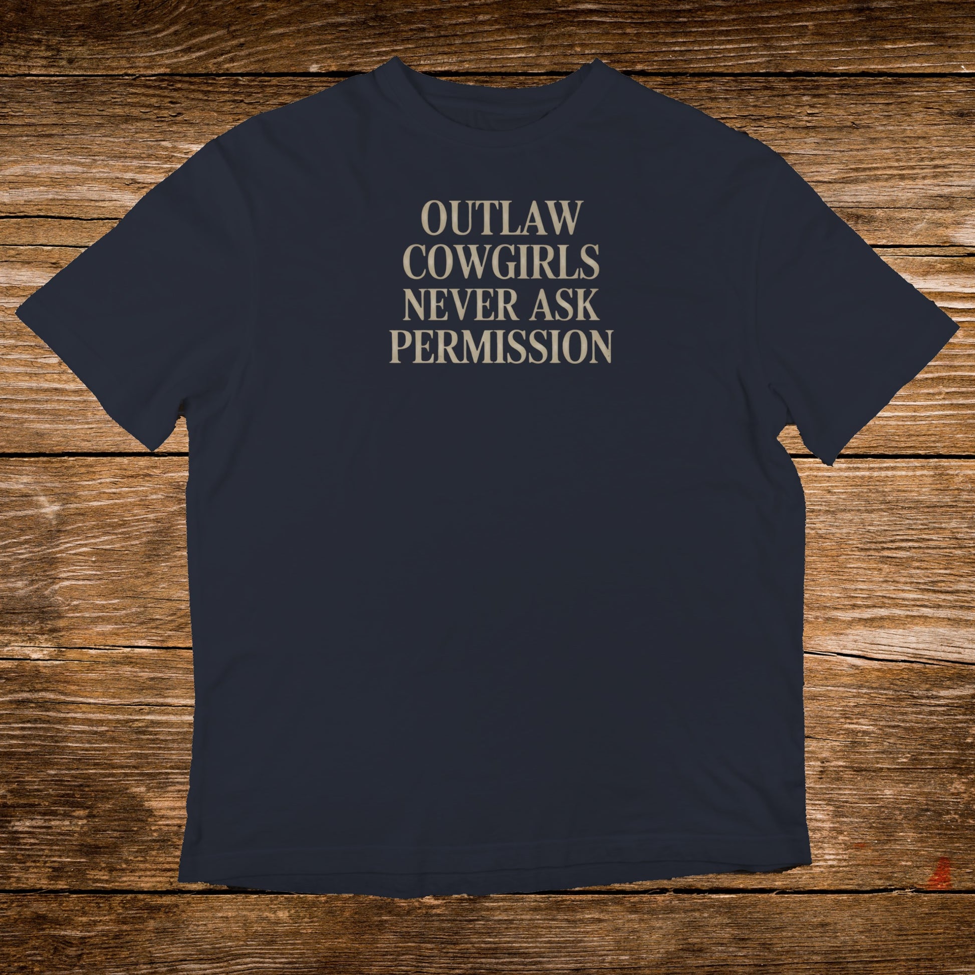 Navy t-shirt with "OUTLAW COWGIRLS NEVER ASK PERMISSION" text in tan.