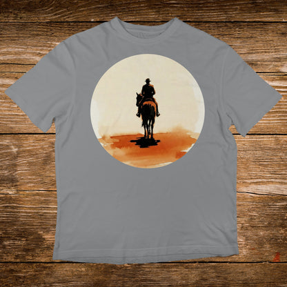 Silhouette of cowboy on horseback against a large, hazy sun.