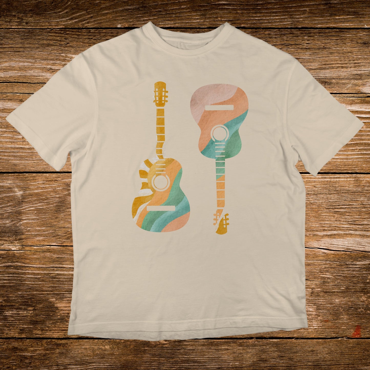 Two abstract guitars with colorful wavy patterns on a cream t-shirt.