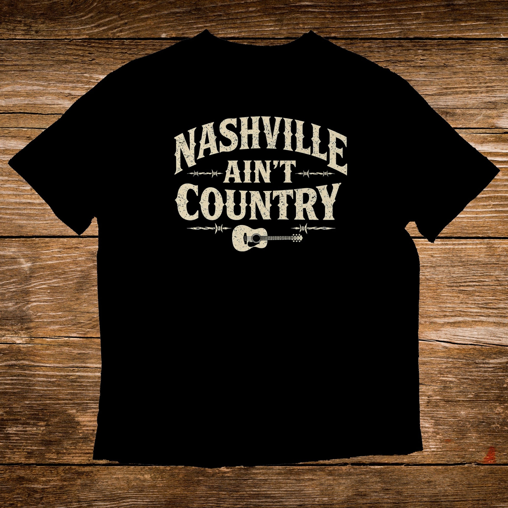 Black t-shirt with "Nashville Ain't Country" text and guitar graphic.