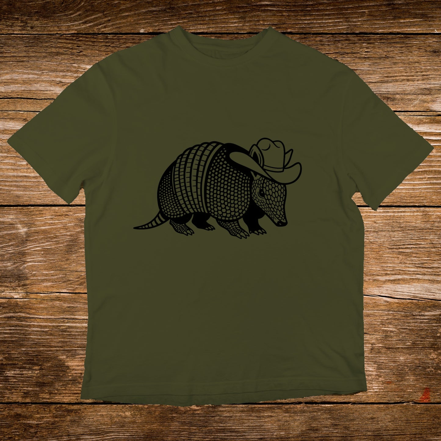Armadillo wearing a cowboy hat graphic on a green t-shirt.